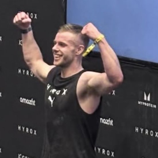 Dom Sharpe celebrating after finishing a HYROX Manchester race